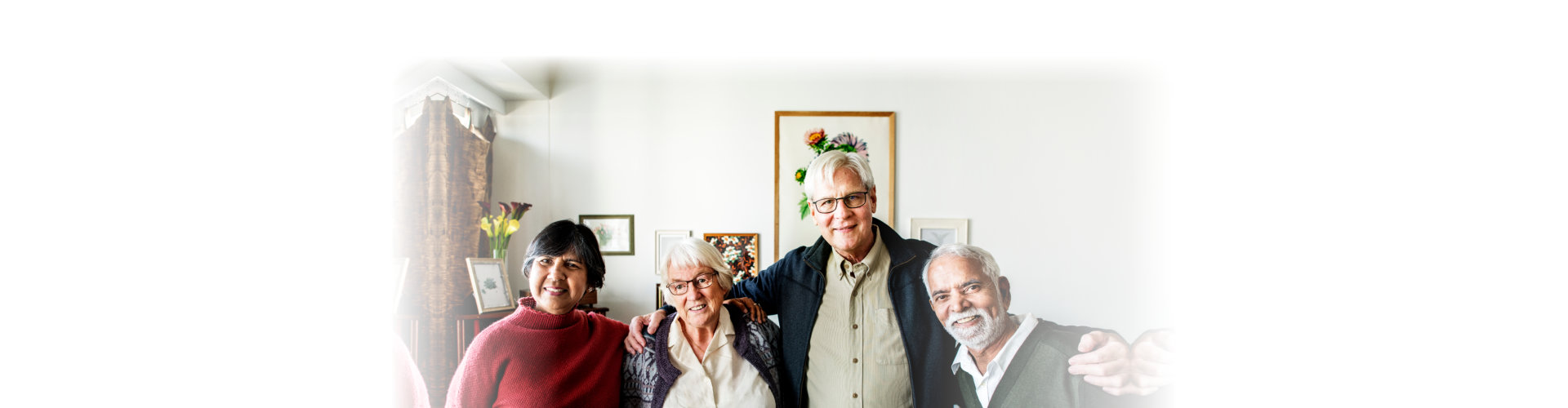 Group of senior friends arms around each other